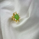 Elegant Gold Ring with Green Gemstone & Pearl Accents