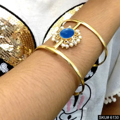 Elegant Gold Cuff Bracelet with Blue Stone and Pearl Accents